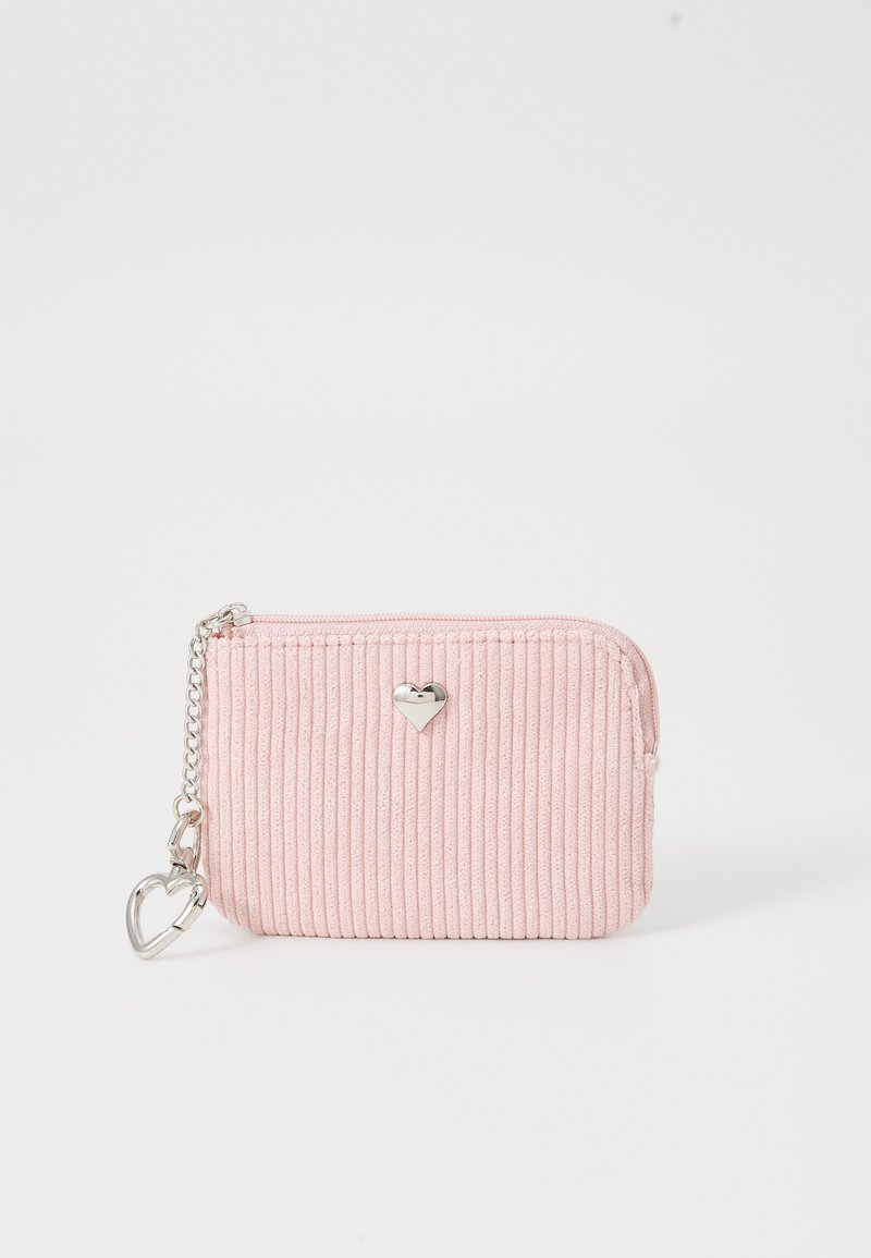 Pink corduroy wallet with vertical ribbed texture, silver heart accent, and zipper, featuring a chain with a heart-shaped clip.
