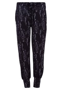 Svarta joggerbyxor med ett vitt abstrakt mönster, elastisk midja med dragsko och smalnande mudd vid anklarna.