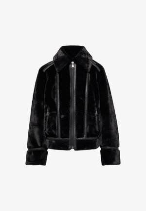 Black faux fur jacket with a zip front, flat collar, leather accents, and two side pockets. Features a textured, plush surface and structured fit.