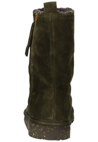 Green suede ankle boot with a textured, cork-like sole; interior lined with gray fur; features a side zipper and pull tab at the top.