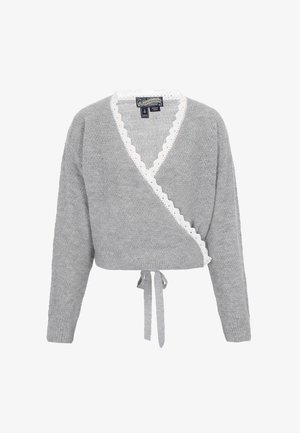 Grå indpakningssweater med lange ærmer, bølget hvid kant langs udkanten og et bånd i taljen; blød tekstur og afslappet design.