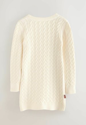 Sweter w kolorze kremowym, dzianinowy, z okrągłym dekoltem i rękawami o długości trzech ćwiartek. Rękawy i dół zakończone ribbą, z małym detalem w kolorach czerwonym, białym i niebieskim.