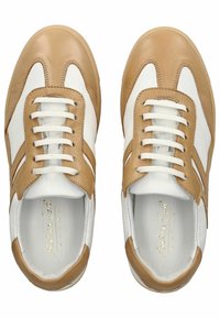 Leather sneakers with a beige and white color scheme, featuring a lace-up design and subtle accent stitching. Smooth texture overall.