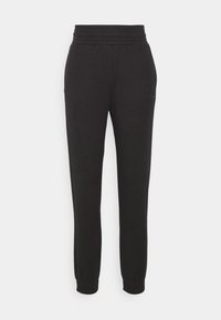 Pantalones de chándal negros con una cintura acanalada, piernas ajustadas y puños elásticos. Confeccionados con una tela suave, presentan un logo discreto en un costado.