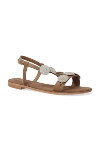 Braune Leder-Sandale mit mehreren metallischen, strukturierten Akzenten auf dem oberen Teil. Flache Sohle mit einem verstellbaren Knöchelriemen.