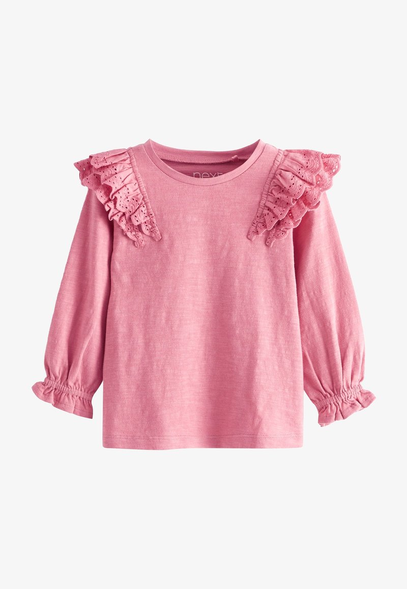 Chemise rose à manches longues pour tout-petit avec des détails en dentelle à œillets volantés sur les épaules et des poignets élastiques à petits volants.