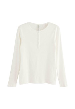 Langærmet hvid henley skjorte lavet af blød bomuld, med rund hals og fire-knaps placket foran. Glat tekstur.