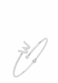 Silver bangle with a zigzag accent and a small gemstone. Features a polished finish and a minimalistic design.
