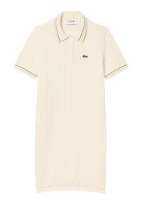 Abito polo in crema chiaro, con texture a coste, maniche corte, una patta con tre bottoni e dettagli a righe verde/giallo sul colletto.