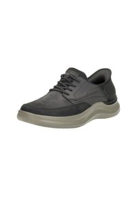 Scarpe in pelle nera con punta arrotondata, dettagli testurizzati e suola in gomma grigia, dotate di chiusura con lacci e supporto imbottito alla caviglia.