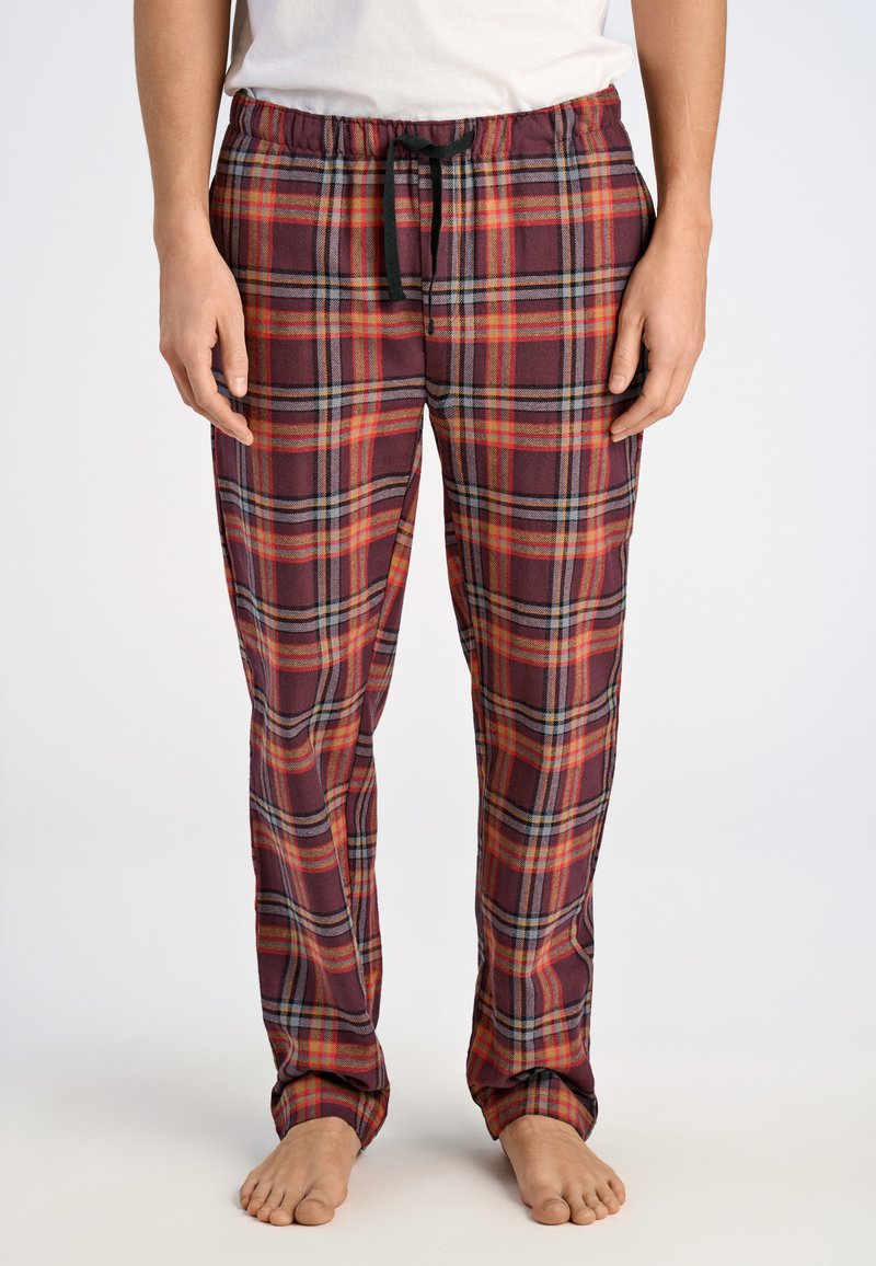 Röda och grå rutiga pyjamasbyxor i mjukt tyg, med elastisk midja och svart snörning samt ribbade muddar.