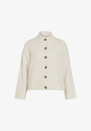 Kremowy dzianinowy kardigan z wysokim kołnierzem, zapinany na guziki z przodu, z prążkowanymi mankietami. Posiada sześć okrągłych guzików i krótki fason.