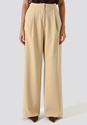 PALAZZO CON PINCES IN TECNICO - Pantaloni - beige