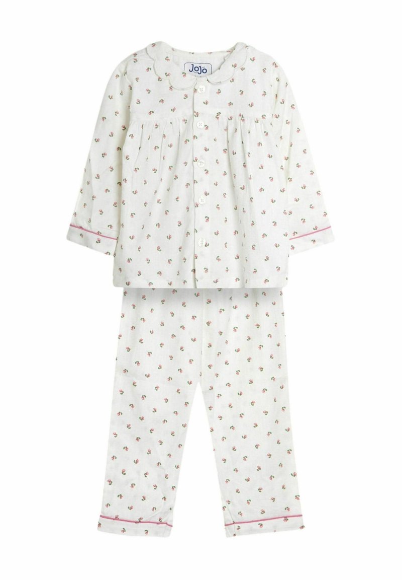 Witte katoenen pyjama set met kleine roze bloemenpatronen, een geknoopte blouse met kraag, en bijpassende broek met roze bies aan de manchetten.