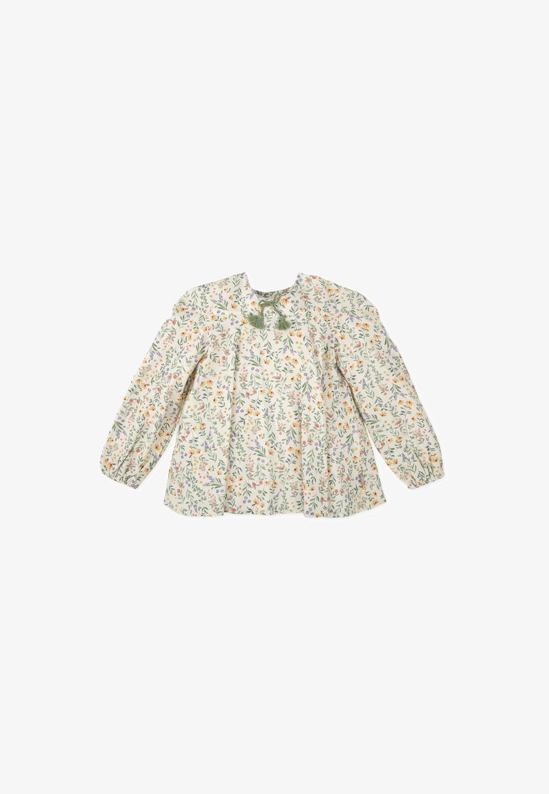 Blouse à manches longues en imprimé floral de couleur crème clair, ornée de fleurs colorées, avec des manches bouffantes et un détail à nouer au niveau du col. Tissu léger.