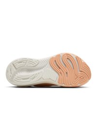 Shoe sole featuring a textured design in white and peach. Grooved patterns enhance grip. Flexible material for improved comfort and durability.