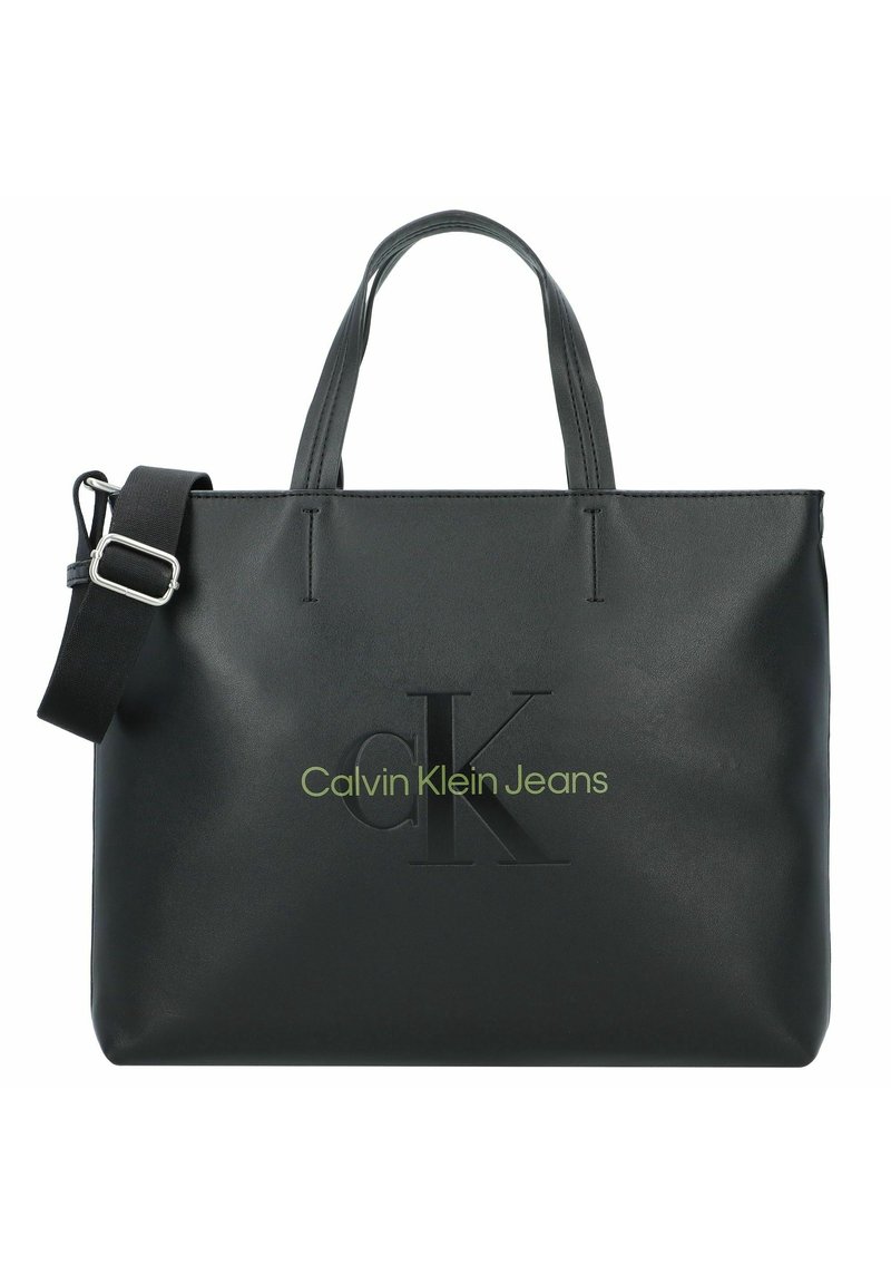 Schwarze synthetische Tragetasche mit doppelten Griffen und verstellbarem Schulterriemen. Mit geprägtem "CK"-Logo und "Calvin Klein Jeans" in Grün.