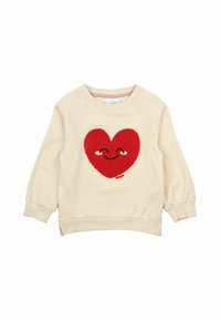 Krämfärgad sweatshirt med ett plyschrött hjärtdesign i mitten, med ögon och ett leende, ribbade muddar och nederkant.