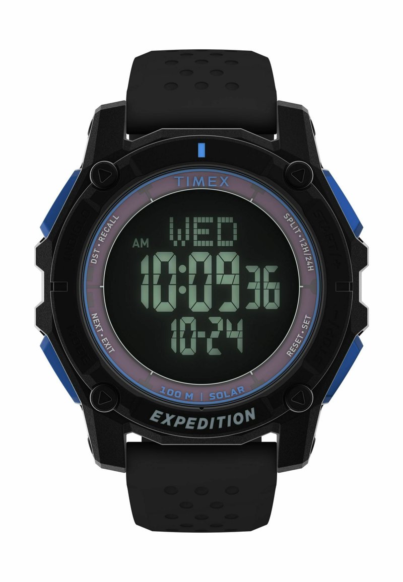 Digitális Timex Expedition óra fekete szilikon szíjjal, kék kiemelésekkel és kerek számlappal, amely zöld LCD-n mutatja az időt és a dátumot.