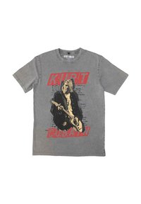 Gray cotton t-shirt featuring a large graphic of a musician with red text reading "KURT COBAIN" below, and handwritten-style notes in the background.