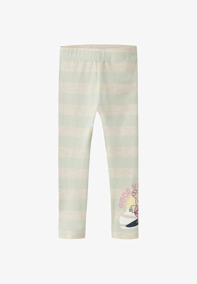 Leggings pour enfants avec des rayures horizontales beige et vert clair et un petit personnage de dessin animé avec le texte « Good Vibes » sur le bas de la jambe.