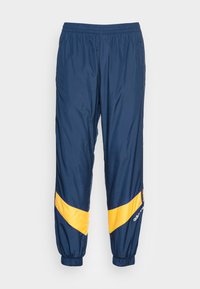 adidas Originals RIPSTOP TRACK - Tracksuit bottoms - collegiate navy ...