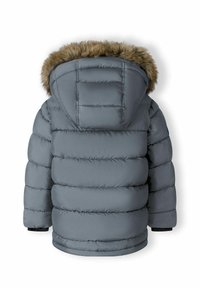 Grå vadderad parkas med en foder av päls på huven, med quiltat mönster, elastiska manschetter och en mjuk textur. Bakre vy visar en voluminös form.