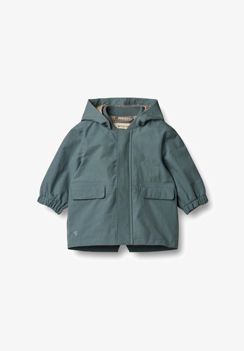 Eine türkisfarbene Kapuzenjacke mit elastischen Bündchen, zwei Fronttaschen und einem karierten Futter. Hergestellt aus einem leichten, wasserabweisenden Material.