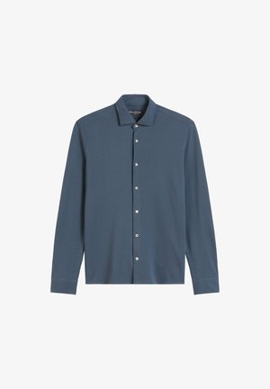Lange mouwen overhemd met knopen in donkerblauw, gemaakt van zachte stof. Beschikt over een kraag, zeven knopen aan de voorkant en een getailleerde silhoutte.