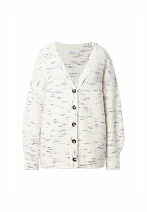 Gilet en tricot crème avec un subtil motif tacheté. Présente un décolleté en V profond, des manches longues et six boutons foncés sur le devant.