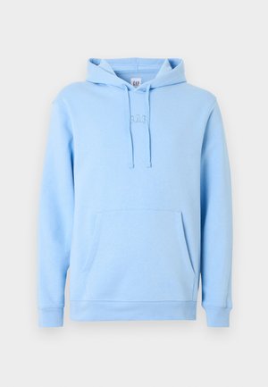 Jasnoniebieska bluza z kapturem wykonana z miękkiej bawełnianej dzianiny. Posiada kieszeń kangurka, kaptur ze sznurkiem i subtelne haftowane logo na piersi.