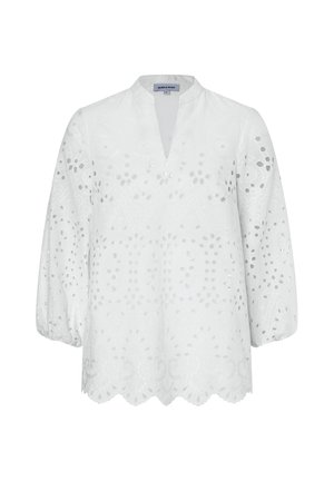 Weiße Langarmbluse mit augenförmigen Blumenmustern, V-Ausschnitt, elastischen Bündchen und geschwungenem Saum, auf einfarbigem Hintergrund dargestellt.