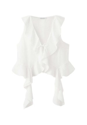 Blouse blanche sans manches avec un profond décolleté en V, bords froncés et un détail noué à l'avant.