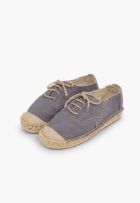 Gray canvas shoes with a round toe, jute accents, and lace-up design; features a textured, woven rope sole and contrasting cap toe.
