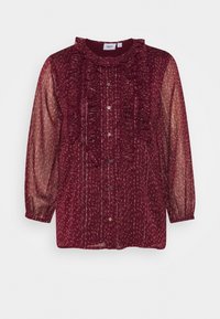 Blusa bordeaux con maniche lunghe trasparenti, colletto arricciato e chiusura con bottoni. Presenta strisce verticali e motivi floreali sottili.