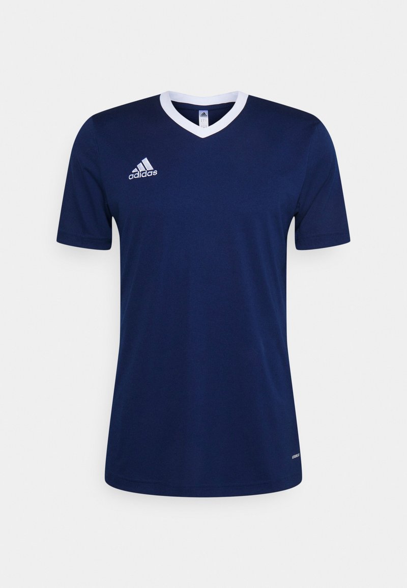 Navy blauwe sportshirt met een witte V-hals, korte mouwen en een geborduurd logo op de linkerkant van de borst. Gemaakt van ademend materiaal.