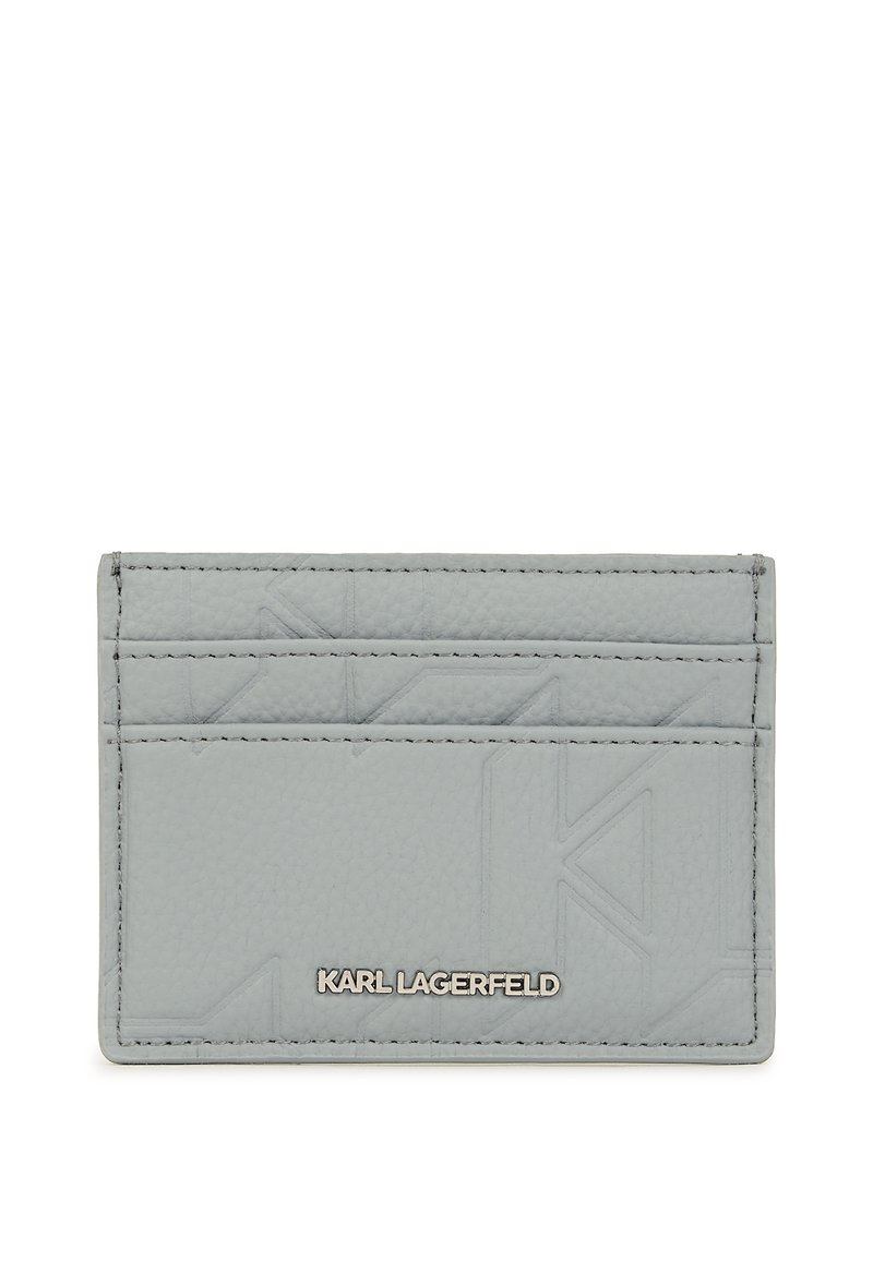 Gray leather cardholder featuring embossed geometric design, multiple card slots, and silver-tone branding. Smooth texture with stitched edges.