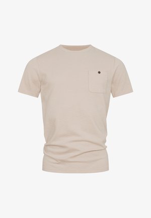 Beige textured short-sleeve t-shirt with crew neck and small chest pocket featuring a dark button.