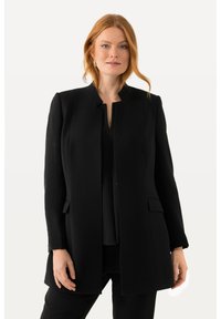 Schwarzer, taillierter langer Mantel mit rundem Ausschnitt, zwei seitlichen Taschen und geradem Schnitt. Hergestellt aus glattem Stoff und mit langen Ärmeln.