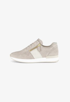 Light grey suede sneaker with a white accent, textured lace-up front, and side zipper detail; features a white rubber sole with ridges.
