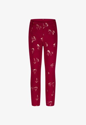 Leggings rouges pour enfants avec des illustrations de chevaux dorés réparties uniformément sur le tissu.