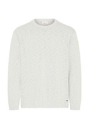 Helehall hall piklike kaelusega pikkade varrukatega kootud kampsun, millel on tekstuuriga kangas ja väike brändi silt vasaku külje ääres.