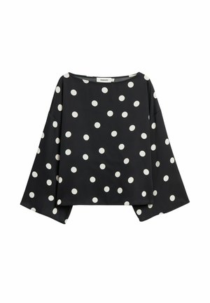 Czarny top w białe grochy, z szerokim dekoltem i luźnymi długimi rękawami. Wykonany z gładkiej tkaniny o swobodnym kroju.