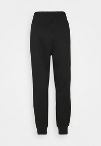 Zwarte, katoenen sweatpants met een ontspannen pasvorm, voorzien van een elastische tailleband en taps toelopende boorden. Gladde textuur, geen zichtbare patronen of details.