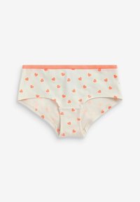 Katoenen slip in crème, met een koraalkleurige tailleband en verspreide hartpatronen in koraal en lichtroze. Zachte textuur, middelhoge pasvorm.