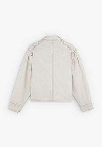Light beige cropped jacket made of textured fabric. Features a collar, long sleeves, and visible stitching along seams.