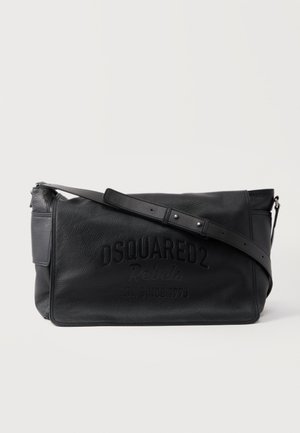 Black leather shoulder bag with adjustable strap and embossed "DSQUARED2 Rebels Estd. Since 1973" logo on front flap.