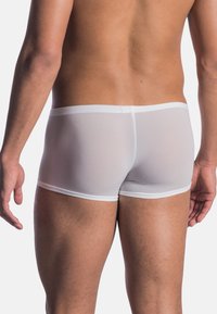 White mesh boxer shorts with elastic waistband, featuring a snug fit and smooth texture, showing the back view on a male model.