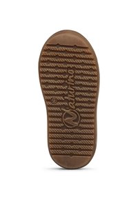 Suela de zapato de goma marrón con patrón de textura, que presenta un logotipo y un acento circular. El diseño incluye líneas acanaladas para mayor tracción.