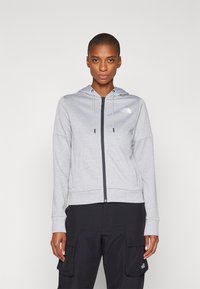 Felpa grigia con zip e cappuccio regolabile, logo sul lato sinistro del petto, realizzata in materiale morbido, con polsini e orlo a costine.